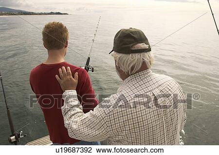 Father and son fishing on boat View Large Photo Image Stock Image - Father and son fishing on boat. Fotosearch