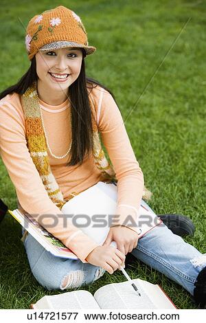 Stock Photo - Female student studying, outdoors, (portrait). Fotosearch