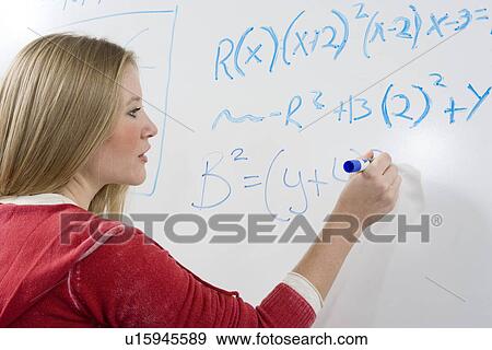 Female student writing maths equations on whiteboard View Large Photo Image Stock Photo - Female student writing maths equations on whiteboard. Fotosearch