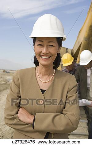 Female surveyor and construction workers on site, portrait View Large Photo Image Stock Photograph - Female surveyor and construction workers on site, portrait. Fotosearch