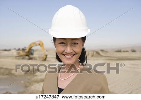 Female surveyor on construction site, portrait View Large Photo Image Stock Photo - Female surveyor on construction site, portrait. Fotosearch