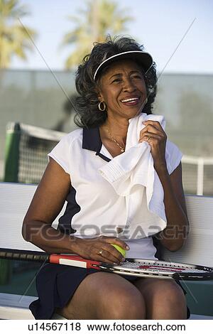 Female tennis player toweling face View Large Photo Image Stock Photo - Female tennis player toweling face. Fotosearch