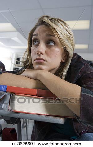 Stock Image - Female University student in classroom. Fotosearch
