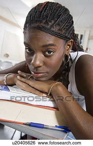 Stock Photograph - Female University student in classroom. Fotosearch
