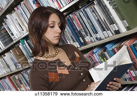 Female University student studying in library View Large Photo Image Stock Photo - Female University student studying in library. Fotosearch