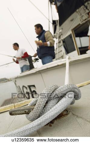 Fishing boat tied to dock View Large Photo Image Stock Photography - Fishing boat tied to dock. Fotosearch