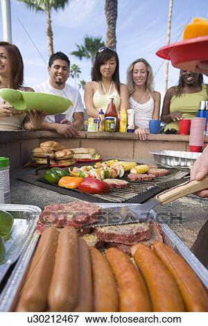 Stock Photo - Friends at Barbecue. Fotosearch