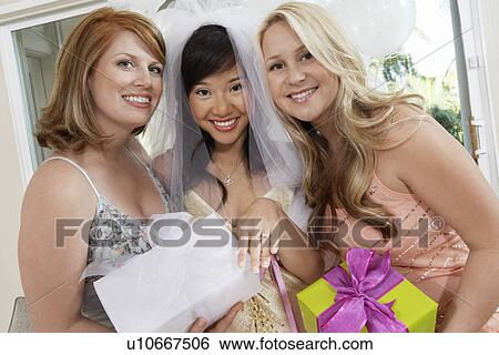 Friends standing Together with gifts at Bridal Shower View Large Photo Image Stock Photograph - Friends standing Together with gifts at Bridal Shower. Fotosearch