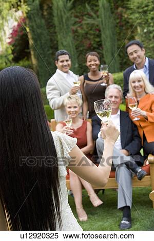 Friends toasting outdoors View Large Photo Image Stock Photography - Friends toasting outdoors. Fotosearch