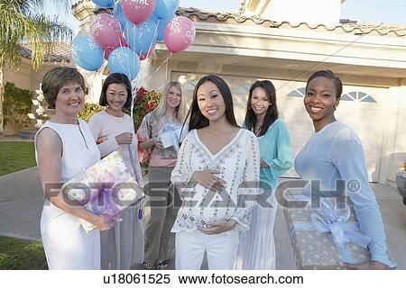 Group of friends with gifts for baby shower outside house View Large Photo Image Stock Photography - Group of friends with gifts for baby shower outside house. Fotosearch