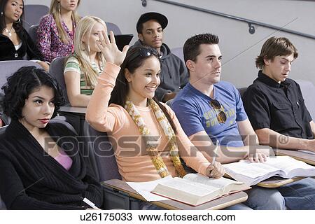 Stock Image - Group of University students in lecture hall. Fotosearch