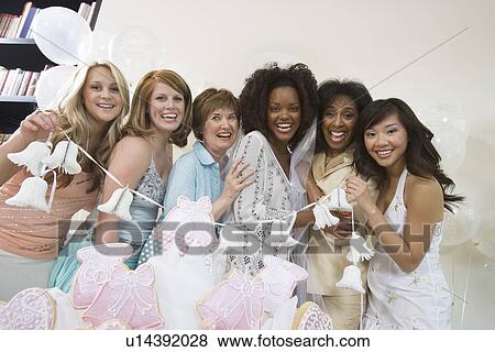 Group of women posing at bridal shower View Large Photo Image Stock Photo - Group of women posing at bridal shower. Fotosearch