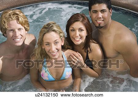 Stock Image - Group Portrait on Hot Tub. Fotosearch
