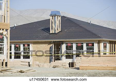 Stock Image - House construction. Fotosearch