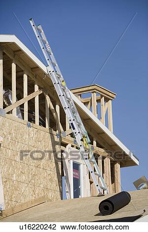 Ladder on wooden house construction View Large Photo Image Stock Image - Ladder on wooden house construction. Fotosearch
