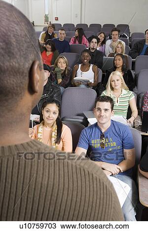 Lecturer teaching University students in lecture hall View Large Photo Image Stock Image - Lecturer teaching University students in lecture hall. Fotosearch