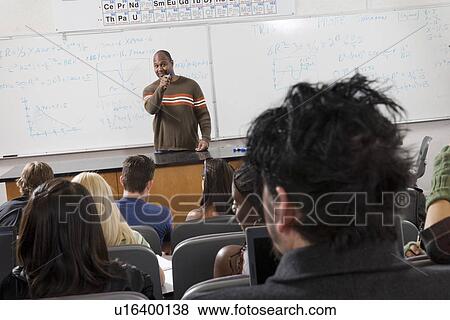 Stock Photo - Lecturer teaching University students in classroom. Fotosearch