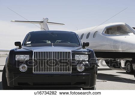 Limousine and private jet on landing strip. View Large Photo Image Stock Image - Limousine and private jet on landing strip.. Fotosearch