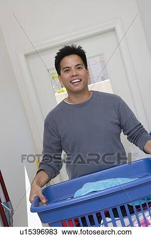 Stock Image - Man doing housework. Fotosearch