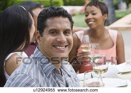Man drinking wine with friends outdoors View Large Photo Image Stock Photography - Man drinking wine with friends outdoors. Fotosearch