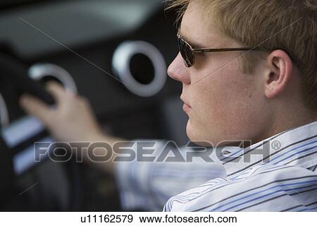 Stock Photo - Man Driving Car. Fotosearch