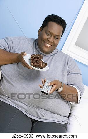 Man Eating Brownies View Large Photo Image Stock Image - Man Eating Brownies. Fotosearch