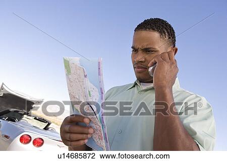 Stock Image - Man Having Car Trouble. Fotosearch