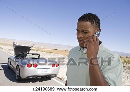 Stock Photo - Man Having Car Trouble. Fotosearch