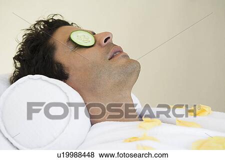 Stock Photo - Man having facial treatment, close-up. Fotosearch