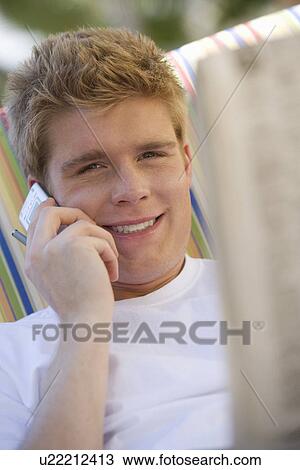 Stock Image - Man Holding Cell Phone. Fotosearch