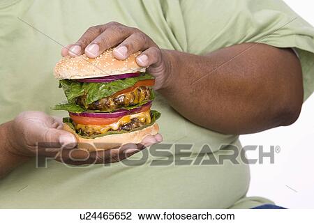 Man Holding Hamburger View Large Photo Image Stock Image - Man Holding Hamburger. Fotosearch