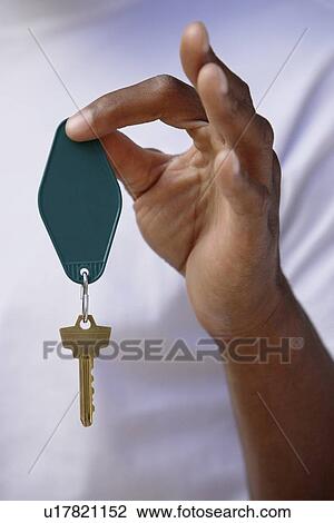 Man holding key in hand, close up on hand View Large Photo Image Stock Image - Man holding key in hand, close up on hand. Fotosearch
