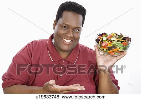 Stock Photo - Man Holding Salad. Fotosearch