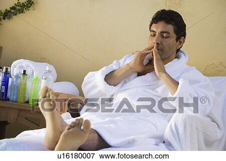 Man in bathrobe, relaxing outdoors View Large Photo Image Stock Photo - Man in bathrobe, relaxing outdoors. Fotosearch