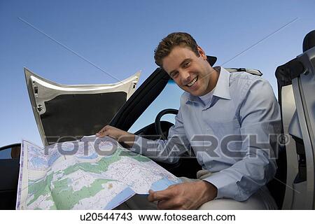 Stock Image - Man Looking at Map. Fotosearch