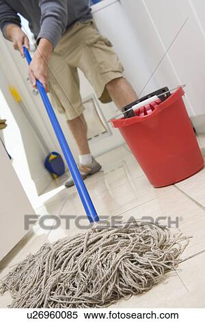 Man mopping floor View Large Photo Image Stock Photography - Man mopping floor. Fotosearch