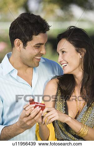 Stock Photo - Man proposing to woman. Fotosearch