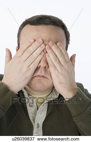 Stock Photo - Man scratching head, looking up. Fotosearch