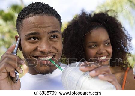 Stock Photo - Man Using Cell Phone. Fotosearch