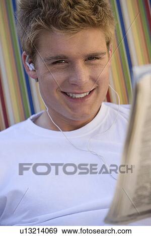 Stock Photo - Man Wearing Earbuds. Fotosearch