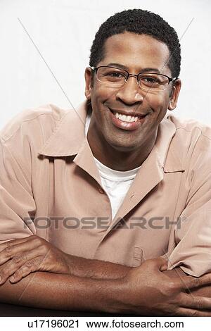 Man wearing glasses, portrait, head and shoulders View Large Photo Image Stock Image - Man wearing glasses, portrait, head and shoulders. Fotosearch