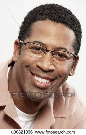 Stock Photograph - Man wearing glasses, portrait, head and shoulders. Fotosearch