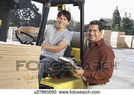 Manager with Forklift Driver at Warehouse View Large Photo Image Stock Image - Manager with Forklift Driver at Warehouse. Fotosearch