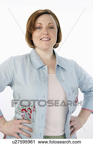 Stock Image - Mature woman standing, half-length portrait. Fotosearch