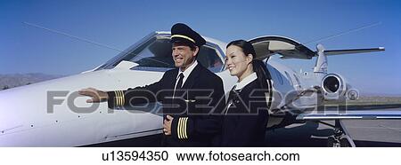 Members of Flight Crew Standing by Airplane View Large Photo Image Stock Image - Members of Flight Crew Standing by Airplane. Fotosearch