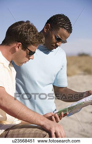 Stock Image - Men Looking at Road Map. Fotosearch