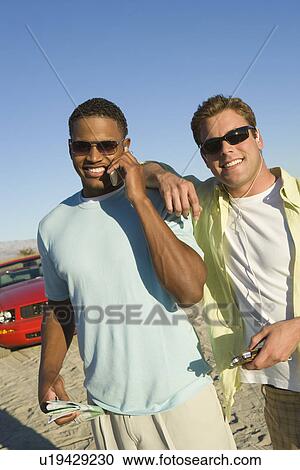 Stock Image - Men Using Cell Phone. Fotosearch