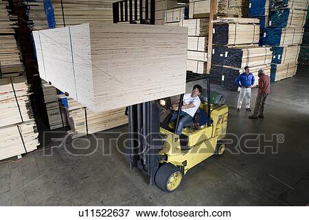 Men working in warehouse View Large Photo Image Stock Photo - Men working in warehouse. Fotosearch