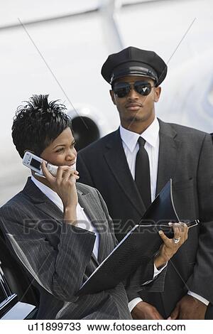 Mid-adult businesswoman using mobile phone. View Large Photo Image Stock Image - Mid-adult businesswoman using mobile phone.. Fotosearch