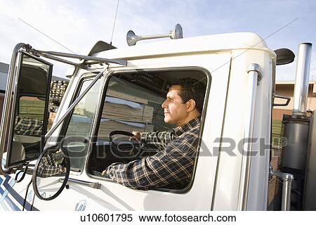 Stock Photography - Mid-adult truck driver. Fotosearch